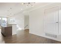 Open living room with hardwood floors and kitchen view at 3329 W 18Th Ave, Denver, CO 80204