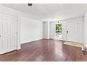 Bright, spacious living room with gleaming wood floors, and a large window at 14465 E Hawaii Cir # A, Aurora, CO 80012