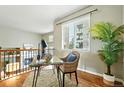 Bright landing area with desk space, natural light, and a view of the neighborhood at 1100 Rockhurst Dr # A, Highlands Ranch, CO 80129