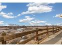 Open space with wooden fence offering a peaceful view at 16058 E Geddes Ln # 26, Aurora, CO 80016