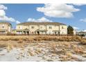 Townhome community with a shared green space at 16058 E Geddes Ln # 26, Aurora, CO 80016