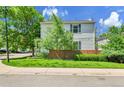 Well-maintained two-story home features a manicured lawn, lush landscaping, and a welcoming exterior at 11803 W Tufts Pl, Morrison, CO 80465