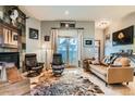 Inviting living room showcasing a stone fireplace, leather seating, and access to the outdoor space at 1753 Race St, Denver, CO 80206