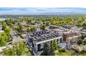 Modern building with rooftop terraces and views of lush surroundings and mountains in the background at 5125 W 29Th Ave # 5, Denver, CO 80212