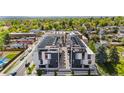 Aerial view of modern condos showing rooftop terraces and the surrounding neighborhood at 5125 W 29Th Ave # 5, Denver, CO 80212