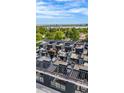 Aerial view of rooftop terraces, each equipped with outdoor seating and modern pergola structures at 5125 W 29Th Ave # 5, Denver, CO 80212
