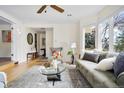 Bright living room with large windows, hardwood floors, and stylish decor, perfect for relaxation at 6843 Fairview Dr, Boulder, CO 80303