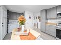 Laundry room with washer, dryer, and additional kitchen cabinets at 1502 Carmelita Ct, Platteville, CO 80651