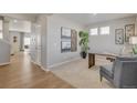 Bright office space with neutral paint, carpet, desk, and modern decor at 4211 Sandstone Dr, Mead, CO 80504