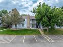 Charming two-story condo featuring dual balconies, a stone chimney and convenient parking at 13404 E Jewell Ave # 101, Aurora, CO 80012