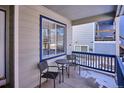 Small front porch with two chairs and a table at 8716 Starwood Ln, Parker, CO 80134