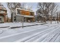 Modern home on a snow-covered street, neighborhood view at 3915 W Byron Pl, Denver, CO 80212