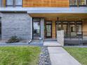 Stylish home entry with stone walkway and modern door at 3915 W Byron Pl, Denver, CO 80212