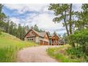Beautiful home with a two car garage and elevated deck at 14271 Timber Trl, Larkspur, CO 80118
