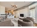 Open-concept living room and kitchen featuring stylish furniture and stainless steel appliances at 1313 S Clarkson St # 205, Denver, CO 80210