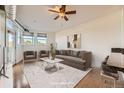 Staged living room showcasing hardwood floors, natural light, and an open floor plan with modern decor at 1313 S Clarkson St # 205, Denver, CO 80210