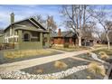 Street view of the home featuring a well maintained lawn, rock details, and inviting facade at 4017 King St, Denver, CO 80211