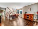 Elegant dining room with hardwood floors and natural light, perfect for hosting gatherings at 10614 Kicking Horse Dr, Littleton, CO 80125