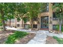 Charming brick apartment building with well-maintained landscaping and visible address above the entrance at 2533 E 11Th Ave # 1, Denver, CO 80206