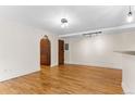 Bright living room with hardwood floors and an arched doorway at 2533 E 11Th Ave # 1, Denver, CO 80206