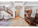 Bright and spacious entryway with hardwood floors and a staircase at 5723 S Union Ct, Littleton, CO 80127