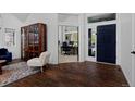 Bright entryway boasting hardwood floors, a high ceiling, and a front office with a large window at 810 Trail Ridge Dr, Louisville, CO 80027