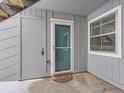 Exterior condo entryway with door and storm door at 7185 S Gaylord St # G13, Littleton, CO 80122