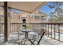 Cozy balcony with a view of the building exterior and landscaped grounds at 10960 W Florida Ave # 113, Lakewood, CO 80232
