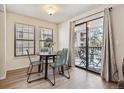 Bright dining area adjacent to balcony at 10960 W Florida Ave # 113, Lakewood, CO 80232