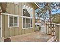 Private front patio with views enhances natural light with a wrought iron fence detail at 857 S Van Gordon Ct # H101, Lakewood, CO 80228