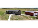 Exterior view of the home on acreage with outbuildings at 28505 County Road 5, Elizabeth, CO 80107