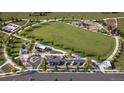 Community park featuring green spaces, walking paths, and playground at 6688 E 149Th Ave # 2, Thornton, CO 80602