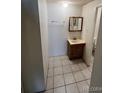 Bathroom featuring tile floor, vanity with sink, and mirror at 8826 E Florida Ave # 204, Denver, CO 80247