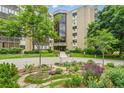 Well-maintained condo building with beautifully landscaped front garden and entryway at 14050 E Linvale Pl # 601, Aurora, CO 80014