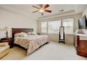 Inviting main bedroom boasting a ceiling fan, large windows, and ample natural light at 17613 E Peakview Ave, Aurora, CO 80016