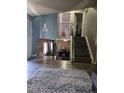 An open living area featuring stylish floors and an open staircase to the upper level at 4416 E 93Rd Pl, Thornton, CO 80229
