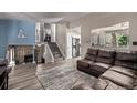 Cozy living room and stairs with natural light featuring an open floor plan at 4416 E 93Rd Pl, Thornton, CO 80229