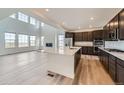 Bright kitchen featuring stainless steel appliances, quartz countertops, and an open concept layout at 630 Sunrise St, Erie, CO 80516