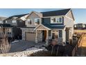 Two-story house with stone accents and a two-car garage at 16508 E 111Th Pl, Commerce City, CO 80022