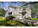 Charming two-story home with a well-maintained front yard and two-car garage at 5523 Stonewall Pl, Boulder, CO 80303