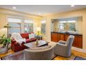 Inviting living room with hardwood floors, bright windows, and comfortable seating at 5523 Stonewall Pl, Boulder, CO 80303