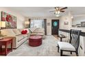 Inviting living room with plush carpet, natural light, and stylish décor at 1424 S Sierra Dr, Castle Rock, CO 80104