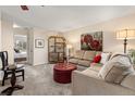 Cozy living room with comfortable seating and a decorative display shelf at 1424 S Sierra Dr, Castle Rock, CO 80104