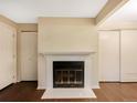 Close-up of a fireplace with white tile and black interior at 6705 S Field St # 803, Littleton, CO 80128