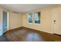 Open living room with two bright windows at 6705 S Field St # 803, Littleton, CO 80128