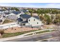 Attractive two-story home featuring stone accents and a well-maintained, landscaped yard at 650 Bishop Pine Way, Castle Rock, CO 80104