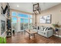 Spacious living room featuring a fireplace and sliding doors to balcony at 1488 Madison St # 505, Denver, CO 80206