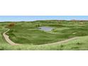 Expansive golf course with lush green fairways, a serene pond, and distant views of rolling hills at 5603 Twilight Way, Parker, CO 80134