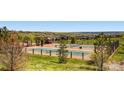 Community tennis and pickleball courts surrounded by landscaping and homes at 5603 Twilight Way, Parker, CO 80134