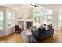 Inviting living room featuring a fireplace, hardwood floors, and plenty of natural light at 805 Summer Hawk Dr # 100, Longmont, CO 80504
